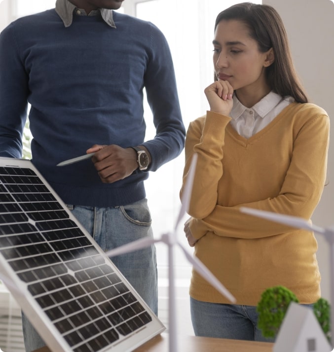 Woman choosing a solar panel with a salesman.